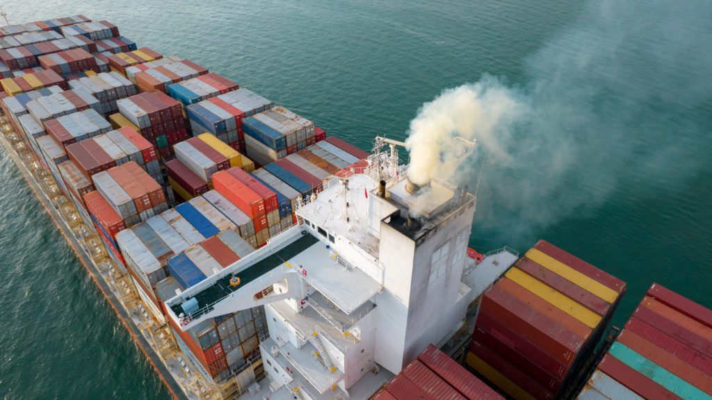 colorful container ship with smoke exhaust gas emissions from cargo lagre ship ,Marine diesel enginse exhaust gas from combustion