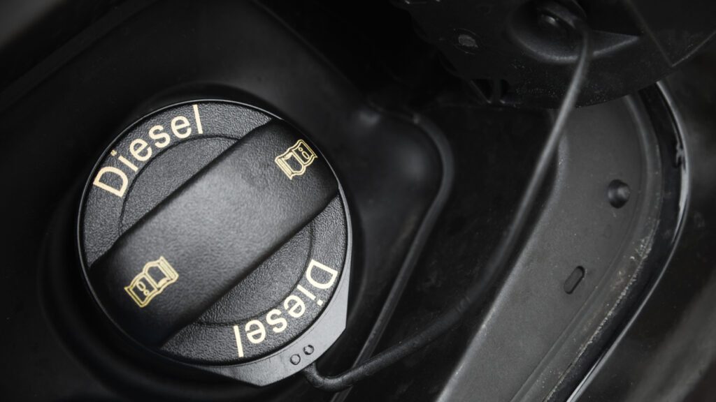 vehicle fuel cap black in color labeled with diesel text