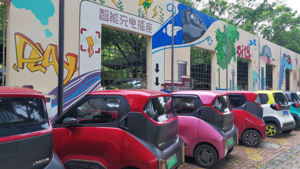 colorful electric minicars parked in a row in Liuzhou, China